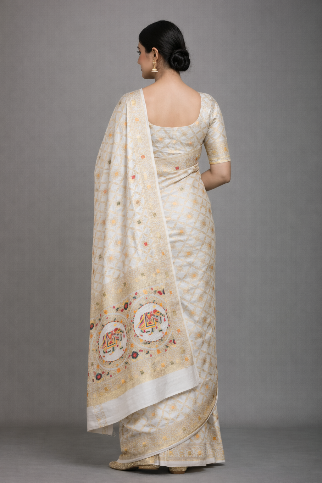 Off White Dola Silk Saree with Royal Elephant & Zari Woven Border