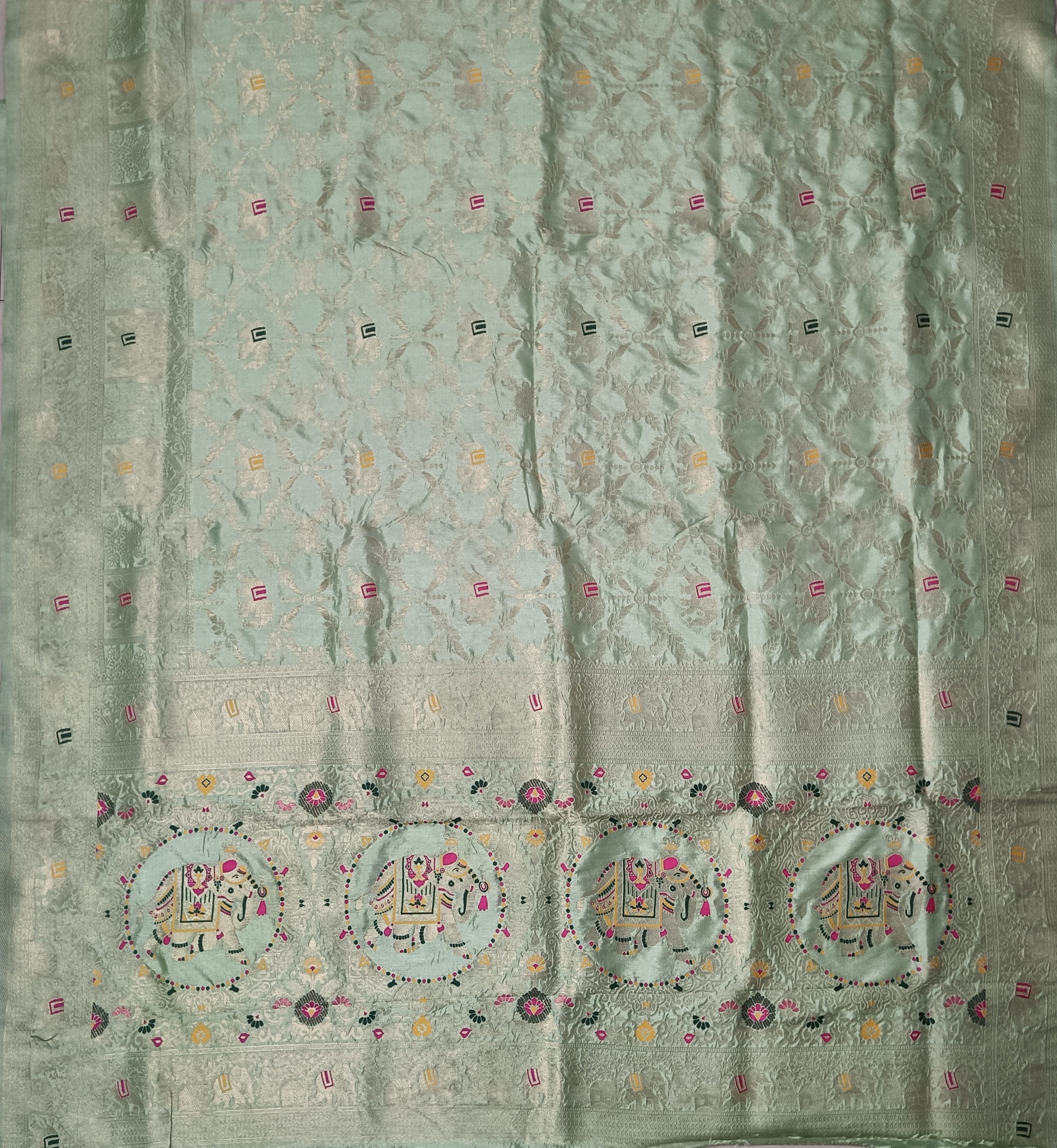Elegant Pastel Mint Green Dola Silk Saree with Royal Elephant & Floral Border