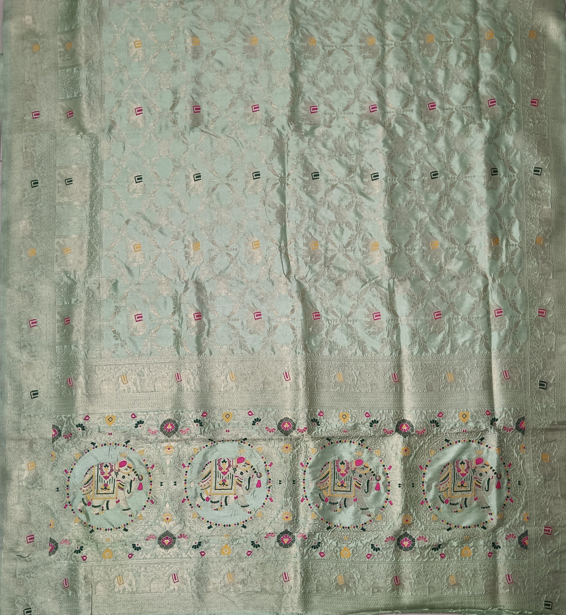Elegant Pastel Mint Green Dola Silk Saree with Royal Elephant & Floral Border
