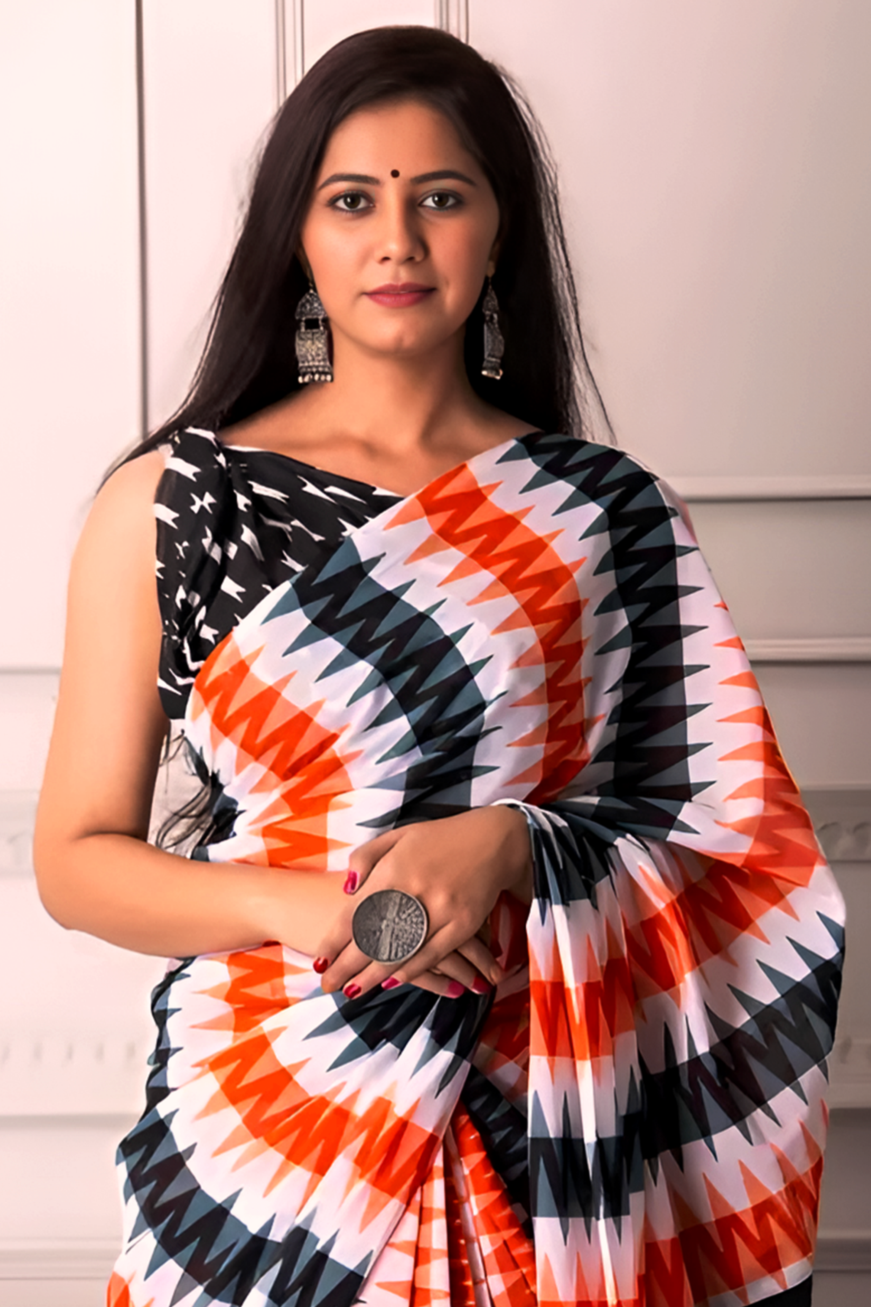 Woman wearing a colorful saree with a white background